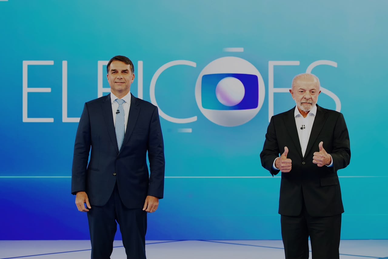 ‘Nove dedos’ x ‘lambendo Trump’: Flávio e Lula se atacam em debate da Globo em perguntas temáticas - Foto