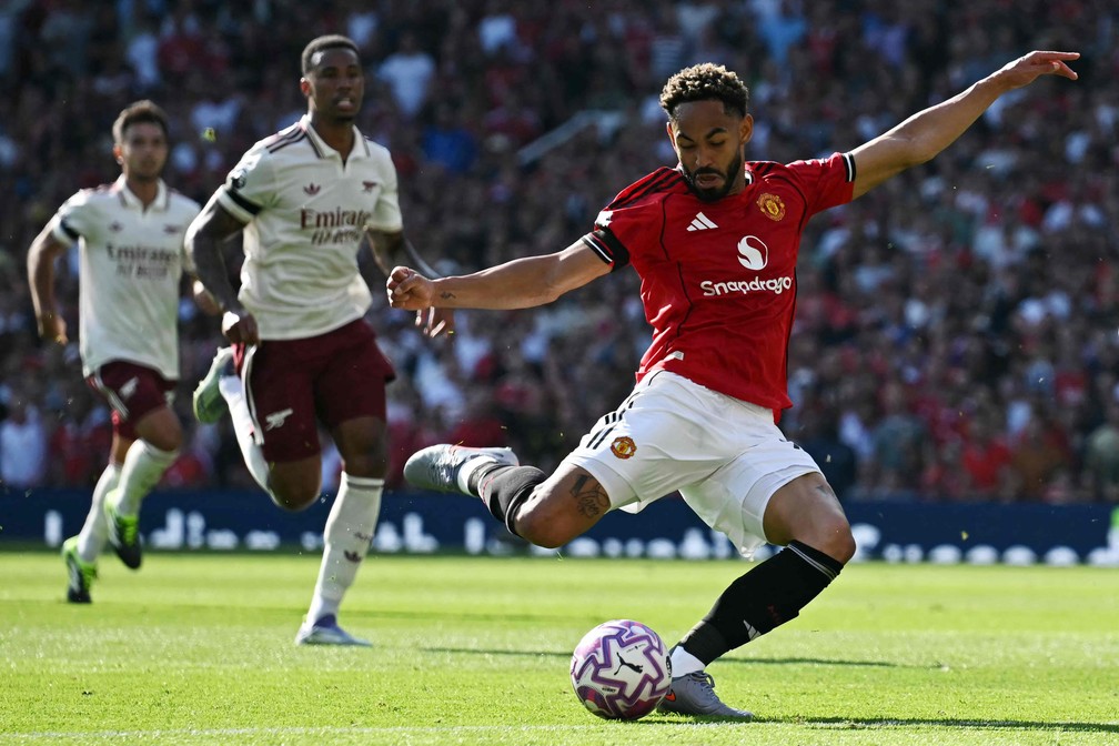 Matheus Cunha é o camisa 10 do Manchester United — Foto: Paul ELLIS / AFP