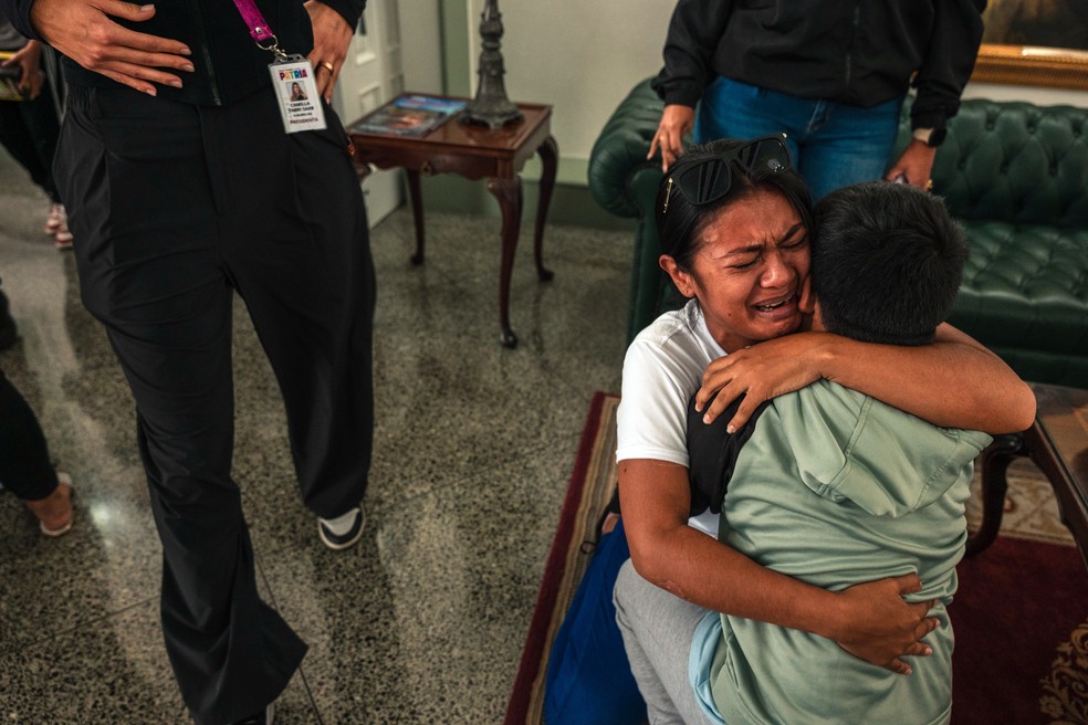 Jimari Jose Cardenas Paz, who was deported from the United States in July, is reunited with her son Jose Daniel Urdaneta Cardenas, 9, at Maiquetia Airport, near Caracas, Venezuela, on September 12, 2025. He remained in the United States when she was deported - Photograph: Adriana Loureiro Fernandez/The New York Times