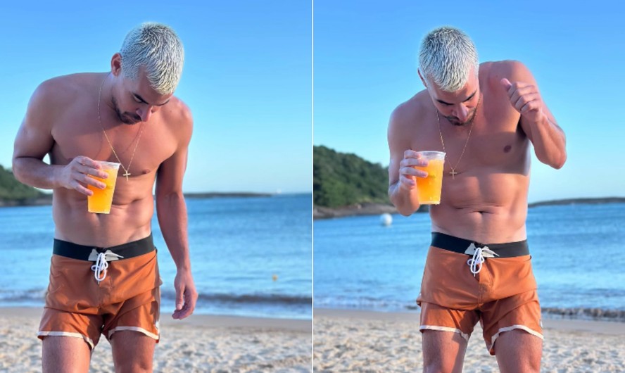 O ator Thiago Martins, de bermuda de praia, aproveita férias