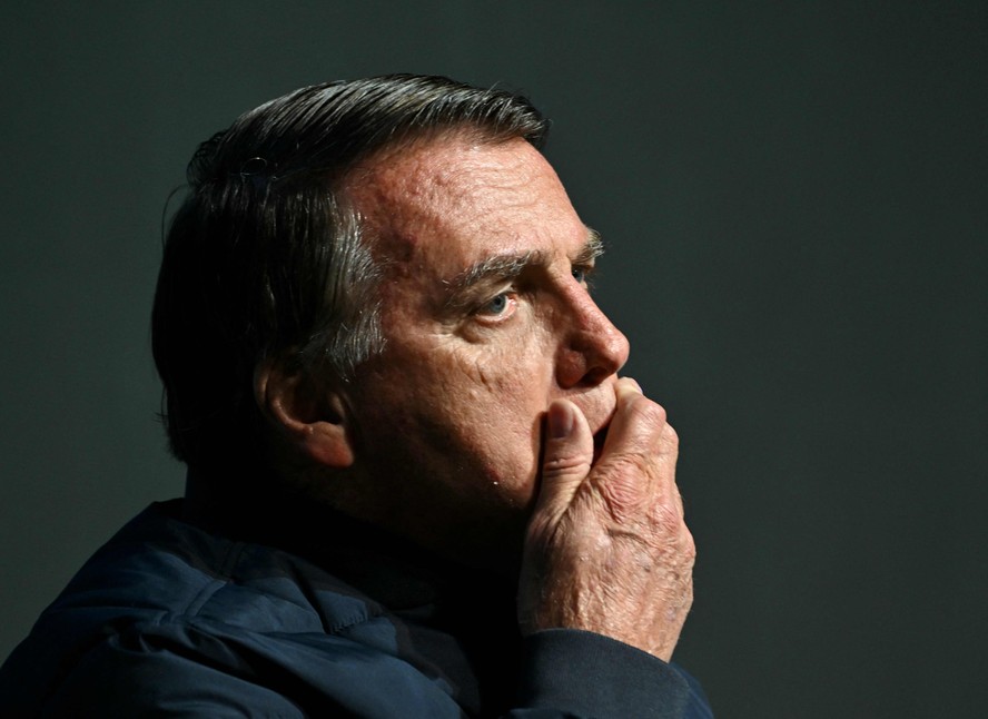 (FILES) Former Brazilian President (2019-2023) Jair Bolsonaro gestures during the CPAC Brazil conference in Balneario Camboriu, Santa Catarina State, Brazil on July 6, 2024. Bolsonaro, who ruled Brazil from 2019 to 2022, is on trial along with seven co-accused for allegedly plotting to illegally cling to power after losing elections to leftist Luiz Inacio Lula da Silva, and the Supreme Court is expected to begin handing down its verdict in the case on September 2, 2025. The former army captain, who has the backing of US President Donald Trump, faces 40 years in prison if convicted.