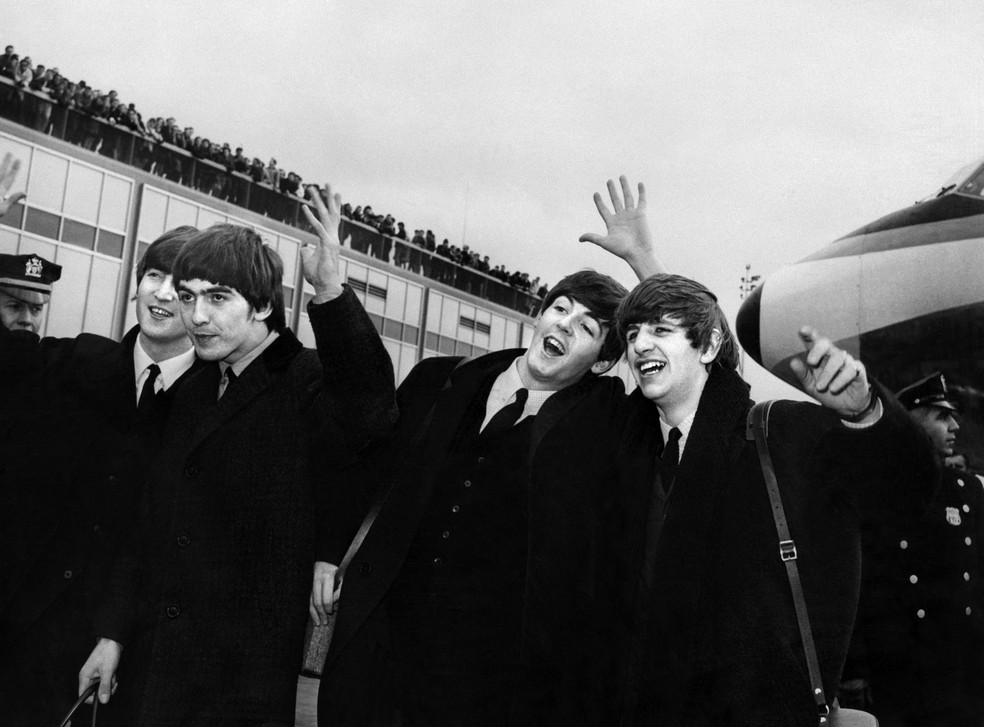 The Beatles at John F. Kennedy Airport, in New York, USA, 1964 – Photo: STR / AFP