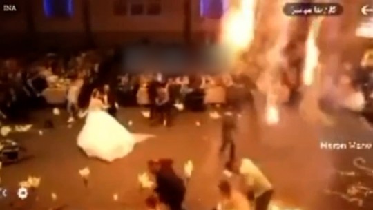 Noivos de casamento que pegou fogo no Iraque estão hospitalizados; mais de 100 morreram