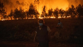 Com Mangueira noChão, Moradores deáguedaDiante do Fogo -foto: Patríciade Melo Moreira/AFP