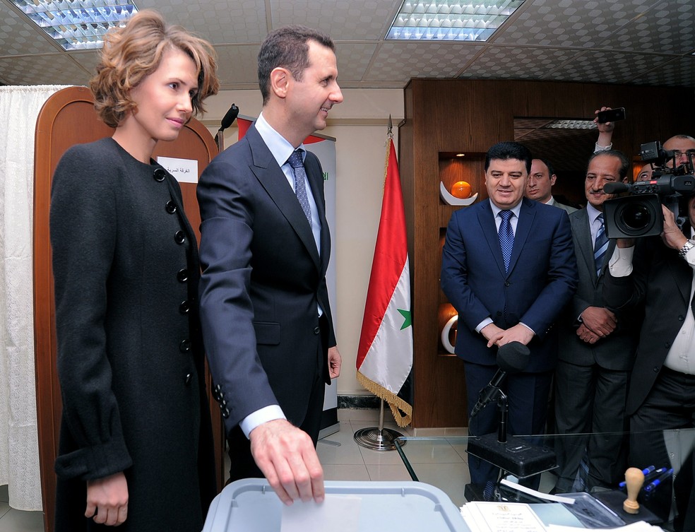 Syrian dictator Bashar al-Assad, alongside first lady Asma al-Assad, voted in a constitutional referendum in 2012 — Photo: SANA/AFP
