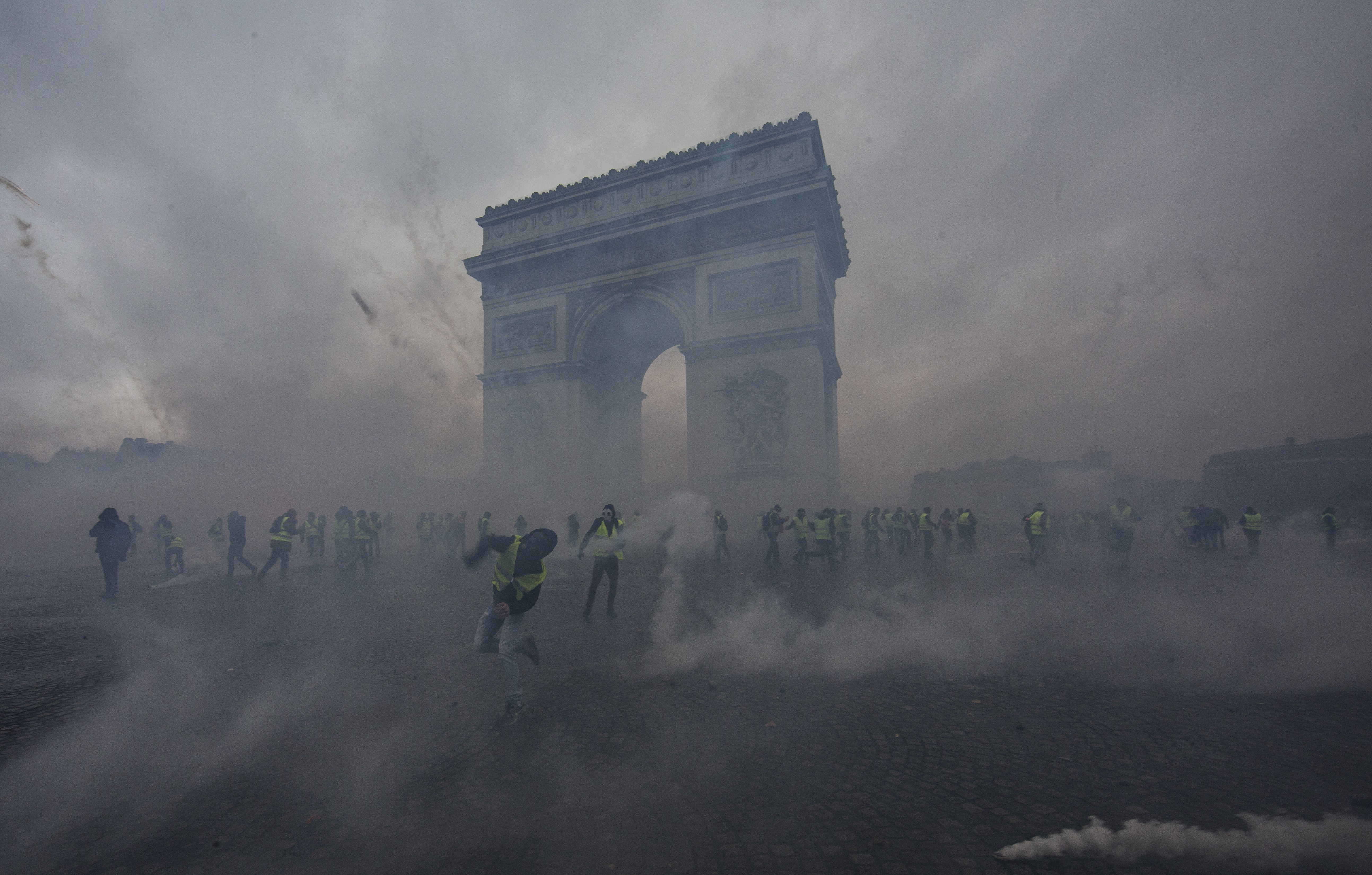 Paris france december teargas surrounds protesters as they clash with riot police dur